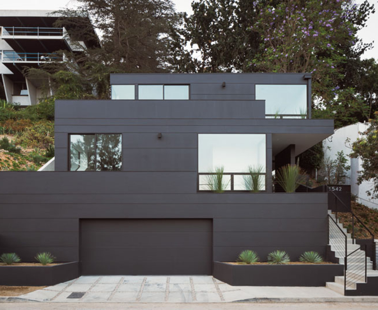 A modern house with a black exterior